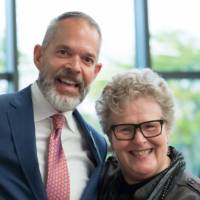 Two guests smiling for a photo.